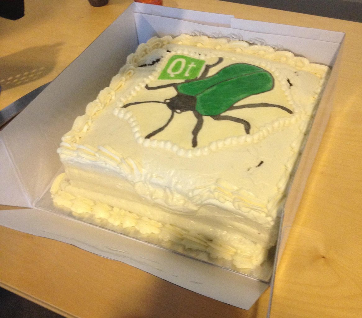 Cake with Qt logo and bug on the icing